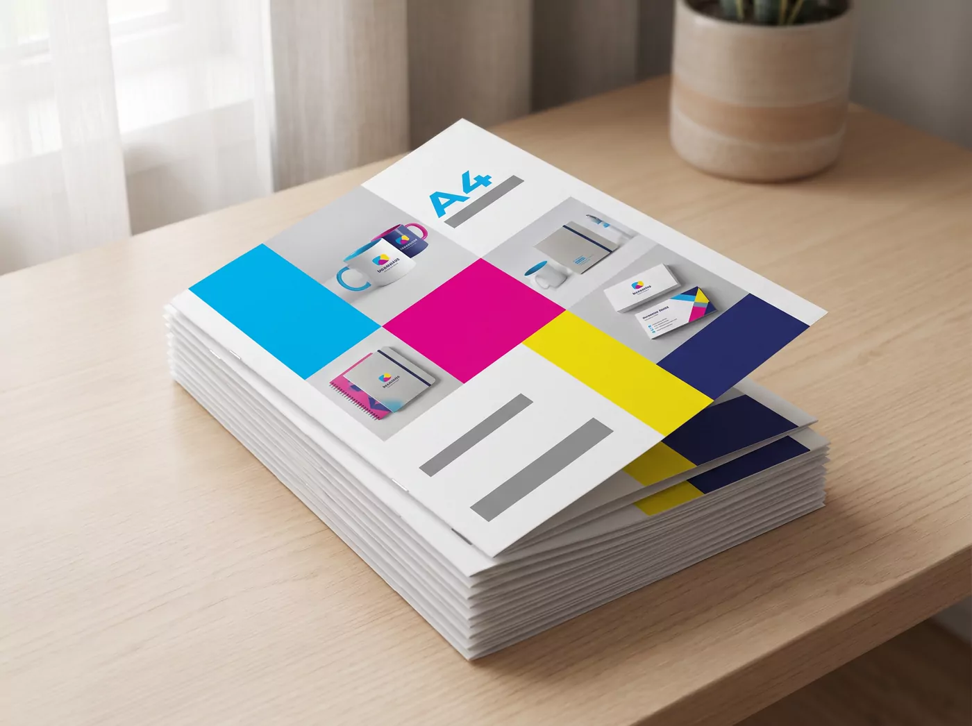 A stack of printed A4 brochures on a desk
