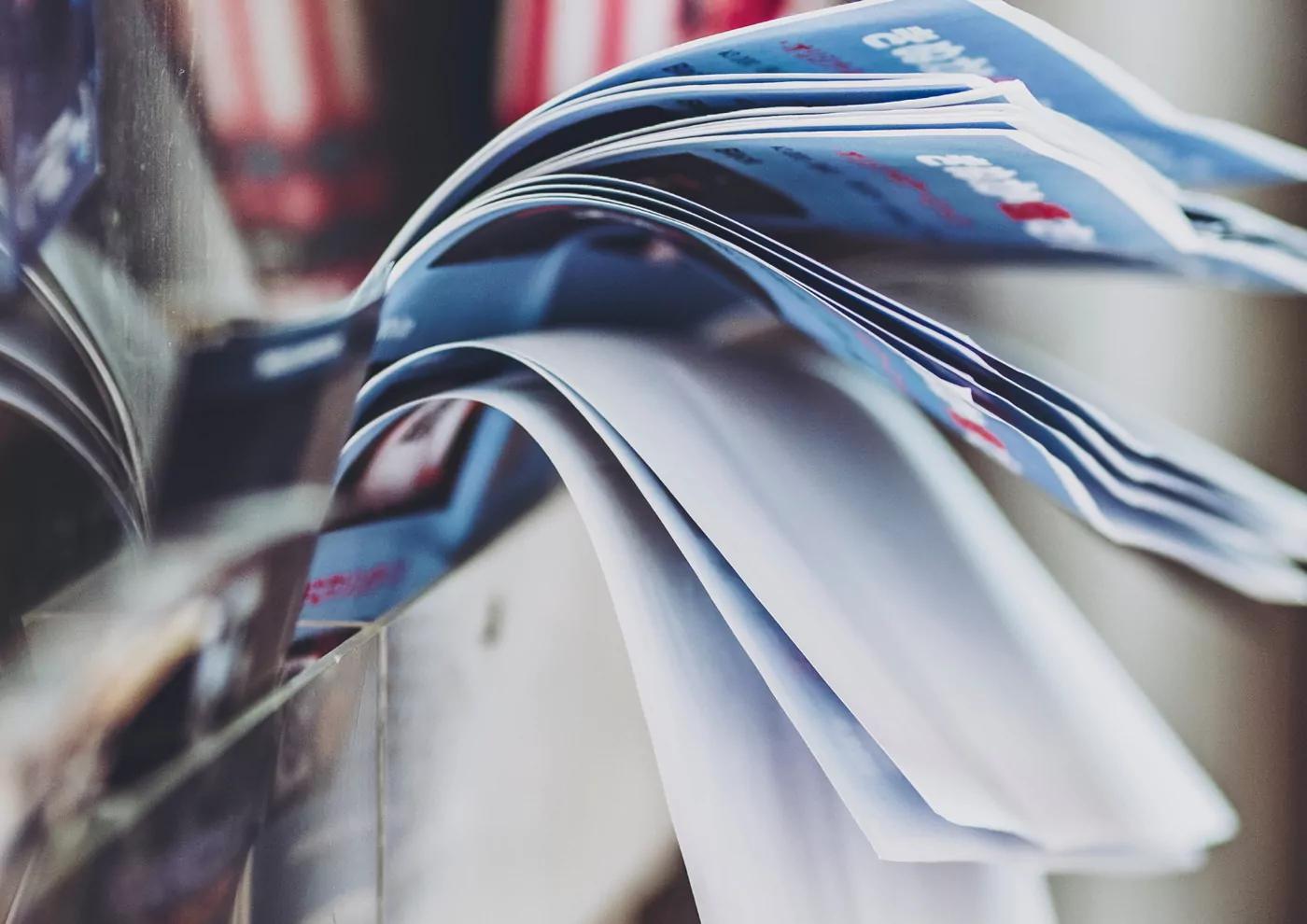 A fanned stack of printed flyers
